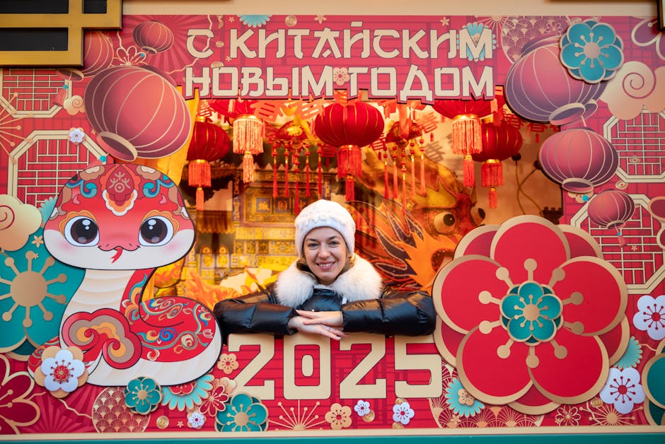 Smiling woman in a festive setting celebrating Chinese New Year with vibrant decorations and lanterns.