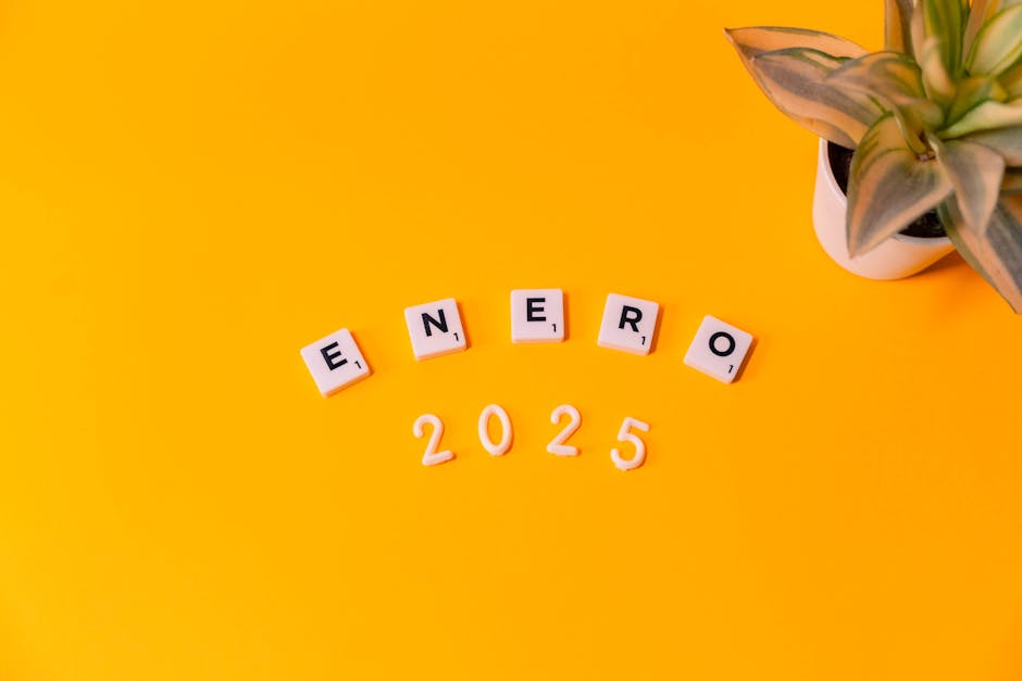 Vibrant yellow January 2025 theme with Scrabble tiles, ideal for planners.